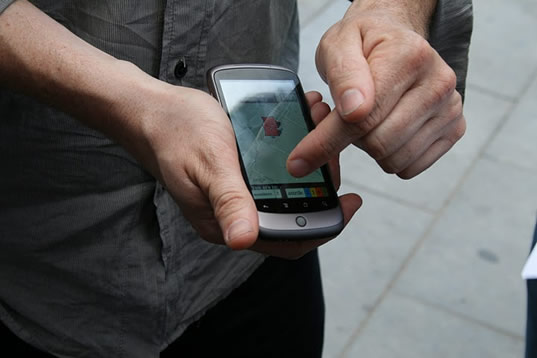 Person playing Exploding Places game on a mobile phone